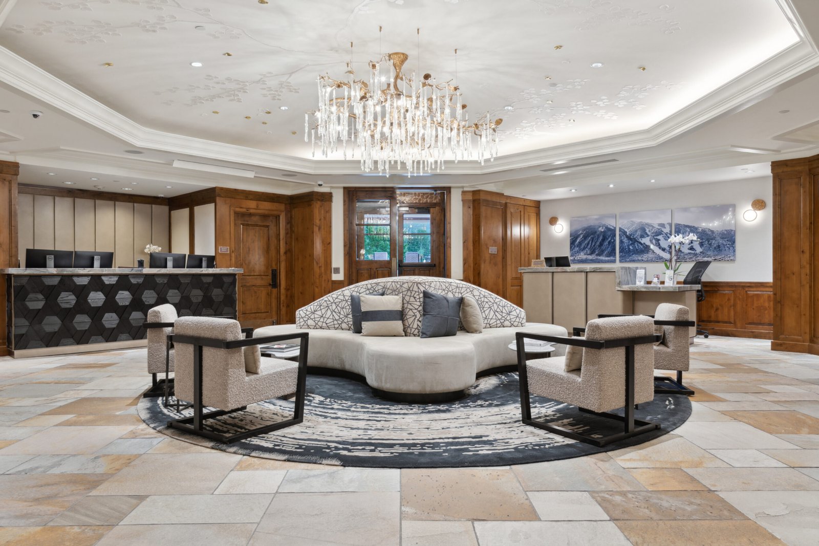 Aspen Mountain Residences 3 Finished Aspen Mountain Residences lobby with central seating, chandelier and reception desks.