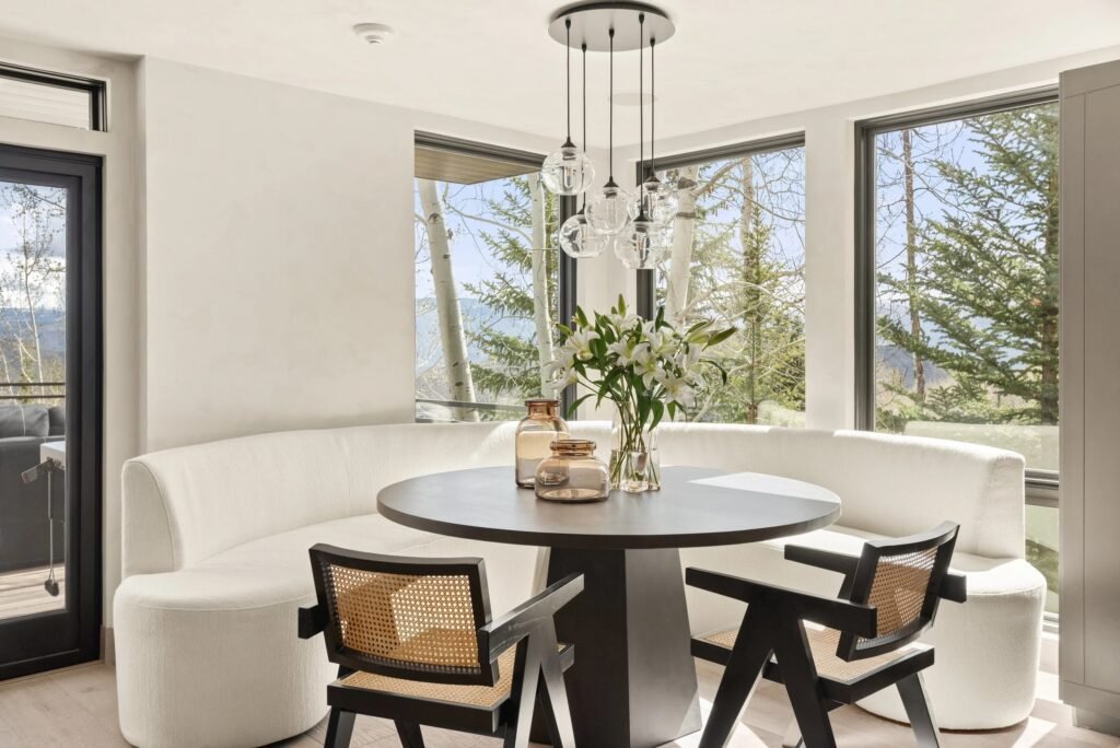 Portfolio 3 Faraway residence dining area with a curved banquette and mountain views in Snowmass