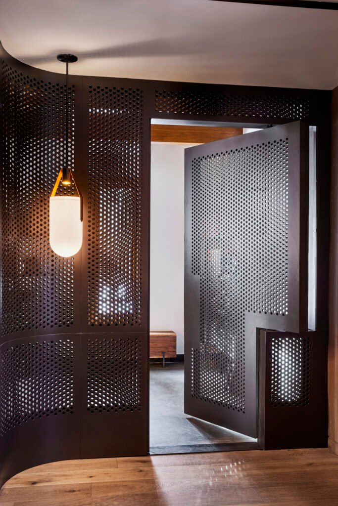 Completed Four Seasons Vail Chalet custom metal entrance door and lighting