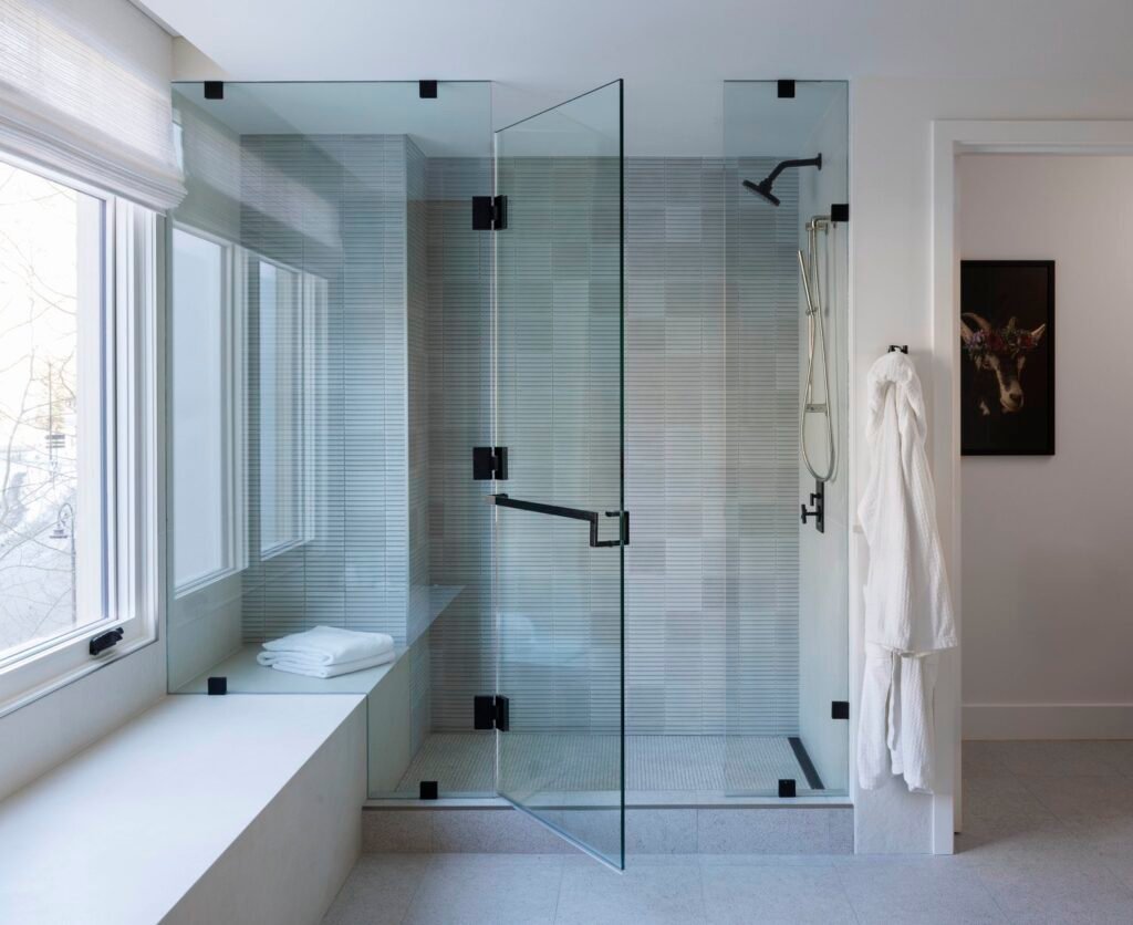 Completed Paris penthouse primary shower at Four Seasons Vail with stone finishes