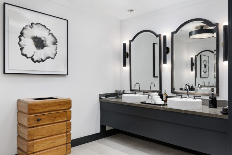 Renovated Four Seasons Vail spa vanity with two vessel sinks and arched mirrors