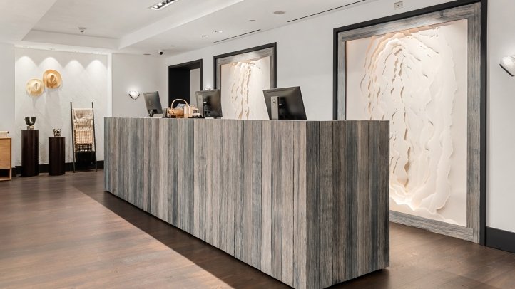 Four Seasons Vail renovated spa reception desk and feature wall