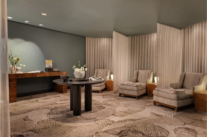 Renovated Four Seasons Vail spa relaxation room with lounge chairs, curtains, and refreshment counter