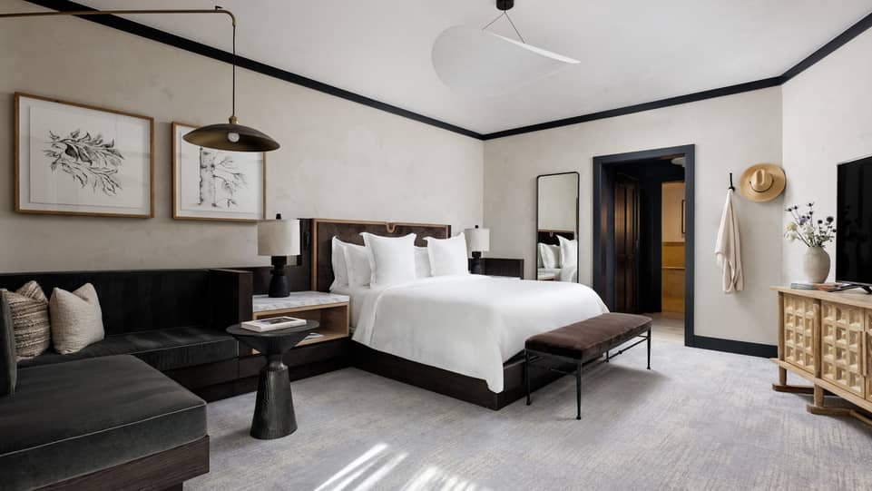Renovated suite bedroom with seating area at Four Seasons Vail