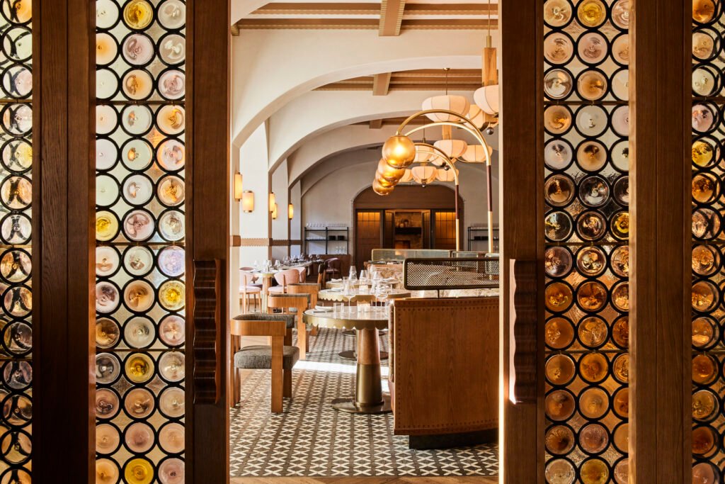 Tavernetta Vail 2 Completed Tavernetta Vail dining room viewed through patterned glass partitions
